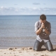 Man praying on a beach about God's will